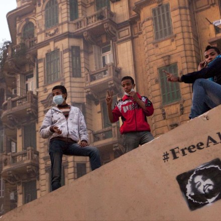 23 November 2011 - Cairo, Egypt - Protesters gather near Mohamed Mahmoud Street. On the wall a meassge saying "Free Alaa". Street battles raged around the heavily fortified Interior Ministry, near Tahrir square, with police and army troops using tear gas and rubber bullets to keep the protesters from storming the ministry. The clashes  have left at least 38 killed and 2,000 protesters wounded, mostly from gas inhalation or injuries caused by rubber bullets fired by the army and the police. The United Nations strongly condemned what it called the use of excessive force by security forces. The clashes resumed despite a promise by Egypt's military ruler to speed up a presidential election to the first half of next year, a concession swiftly rejected by tens of thousands of protesters in Tahrir Square. The military previously floated late next year or early 2013 as the likely date for the vote, the last step in the process of transferring power to a civilian government. The standoff has plunged the country deeper into crisis less than a week before parliamentary elections, the first since the ouster nine months ago of longtime authoritarian leader Hosni Mubarak. Photo credit: Benedicte Desrus / Sipa Press/bdcairo.007/1111232142