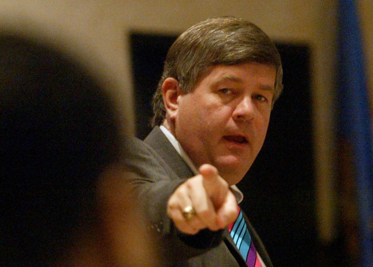 Cleveland County district attorney Tim Kuykendall, points to defendant Darren DeLone, former Nebraska offensive lineman, during closing arguments in DeLone's trial in Norman, Okla., Wednesday, May 4, 2005,  DeLone is charged with one count of aggravated assault and battery on a member of the Oklahoma University spirit group, the Ruf/Neks, at a University of Oklahoma football game, November 13, 2004. (AP Photo)