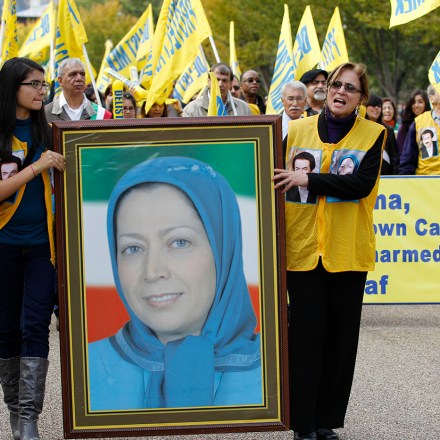 Demonstrators chant as they carry a photo of Iranian opposition leader Maryam Rajavi during a march in Washington after rallying in front of the White House Saturday, Oct. 22,  2011. Hundreds of people rallied, demanding that an Iranian opposition group, Mujahedin-e Khalq (MEK), once allied with Iraq's Saddam Hussein, be removed from a U.S. terror list.  (AP Photo/Jose Luis Magana)