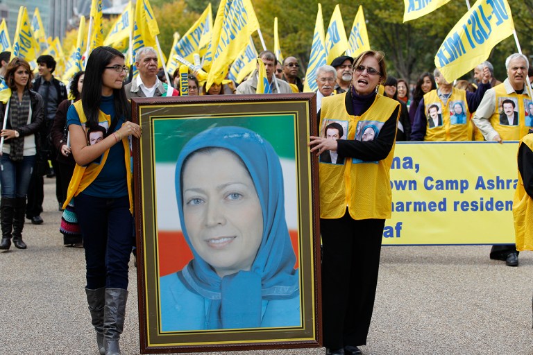 Demonstrators chant as they carry a photo of Iranian opposition leader Maryam Rajavi during a march in Washington after rallying in front of the White House Saturday, Oct. 22,  2011. Hundreds of people rallied, demanding that an Iranian opposition group, Mujahedin-e Khalq (MEK), once allied with Iraq's Saddam Hussein, be removed from a U.S. terror list.  (AP Photo/Jose Luis Magana)