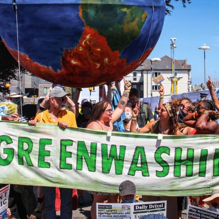 Protesters critical of the Group of Seven countries' environmental policy call for strong action on climate change during a rally in Cornwall, England, on June 12, 2021, as a G-7 summit is under way there. (Kyodo via AP Images) ==Kyodo