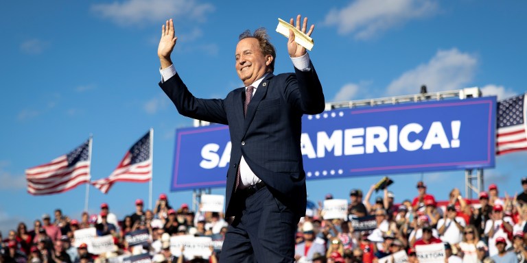 Texas Attorney General Ken Paxton waves to the crowd during a rally featuring former President Donald Trump on Saturday, Oct. 22, 2022, in Robstown, Texas. (AP Photo/Nick Wagner)