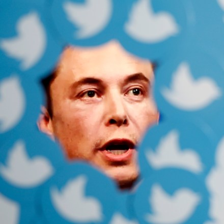 An image of Elon Musk is seen surrounded by Twitter logos, 8 November, 2022.