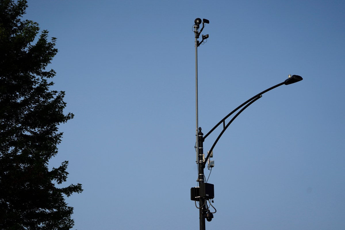 FILE - ShotSpotter equipment overlooks the intersection of South Stony Island Avenue and East 63rd Street in Chicago on Tuesday, Aug. 10, 2021. In more than 140 cities across the United States in 2023, ShotSpotter’s artificial intelligence algorithm and its intricate network of microphones evaluate hundreds of thousands of sounds a year to determine if they are gunfire, generating data now being used in criminal cases nationwide. (AP Photo/Charles Rex Arbogast, File)