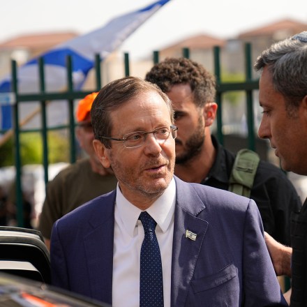 Israeli President Isaac Herzog, front left, visits Sderot, a town close to the Gaza Strip, on Wednesday, Oct.11, 2023. (AP Photo/Ohad Zwigenberg)