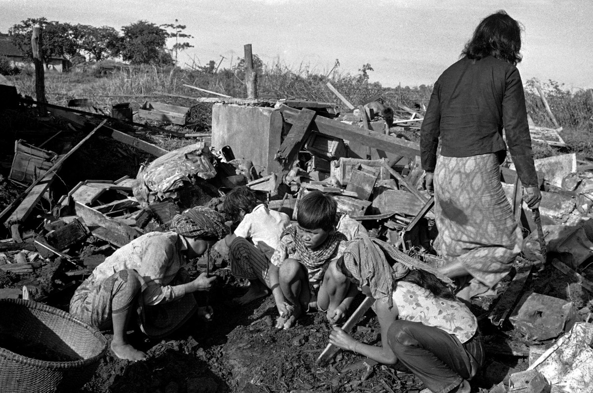 Villagers in Neak Luong, hit  August 6 in misdirected U.S. bombing raid, dig through rubble searching for bodies and belongings  August 7, 1973. (AP Photo)