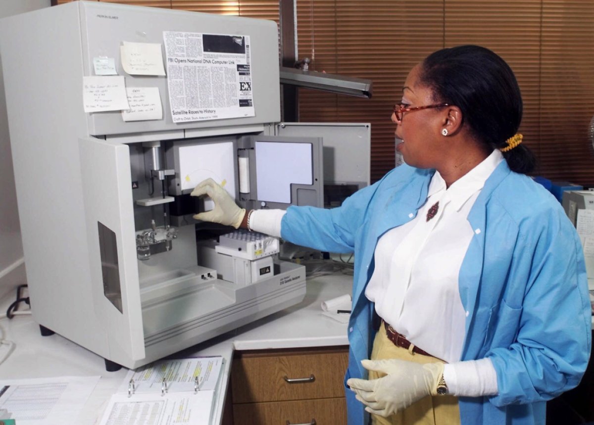 Joyce Gilchrist, Oklahoma City Police Department forensic chemist, shown July 21,1999, working with the Oklahoma City Police Department lab's Genetic Analyzer. The FBI has recommended a review of all cases where Gilchrist linked hair or fibers with a suspect or victim and the evidence "was significant to the outcome of the trial."  The recommendation was part of an FBI report that said Gilchrist gave testimony "that went beyond the acceptable limits of forensic science" or misidentified hair and fibers in at least six criminal cases.  (AP Photo/The Daily Oklahoman, Steve Gooch)