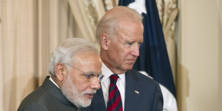 Secretary of State John Kerry, left, and Vice President Joe Biden, right, escort Indian Prime Minister Narendra Modi offstage during a luncheon at the State Department in Washington, Tuesday, Sept. 30, 2014, in the prime minister's honor. Earlier, the prime minister met with President Barack Obama at the White House and toured the Martin Luther King Memorial in Washington with President Obama.  (AP Photo/Cliff Owen)