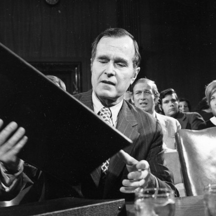 George Bush looks over his material prior to delivering testimony before the Senate Armed Services Committee on his qualification for the job of CIA director, in Washington, D.C., Dec. 15, 1975.  (AP Photo)