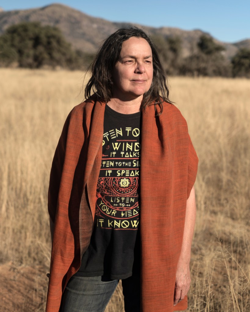 Portrait of Kate Scott near Governor Ducey’s shipping container wall on the US-Mexico border in the Coronado National Forest in Arizona on November 29th, 2022. (Photo by Kitra Cahana for The Intercept)