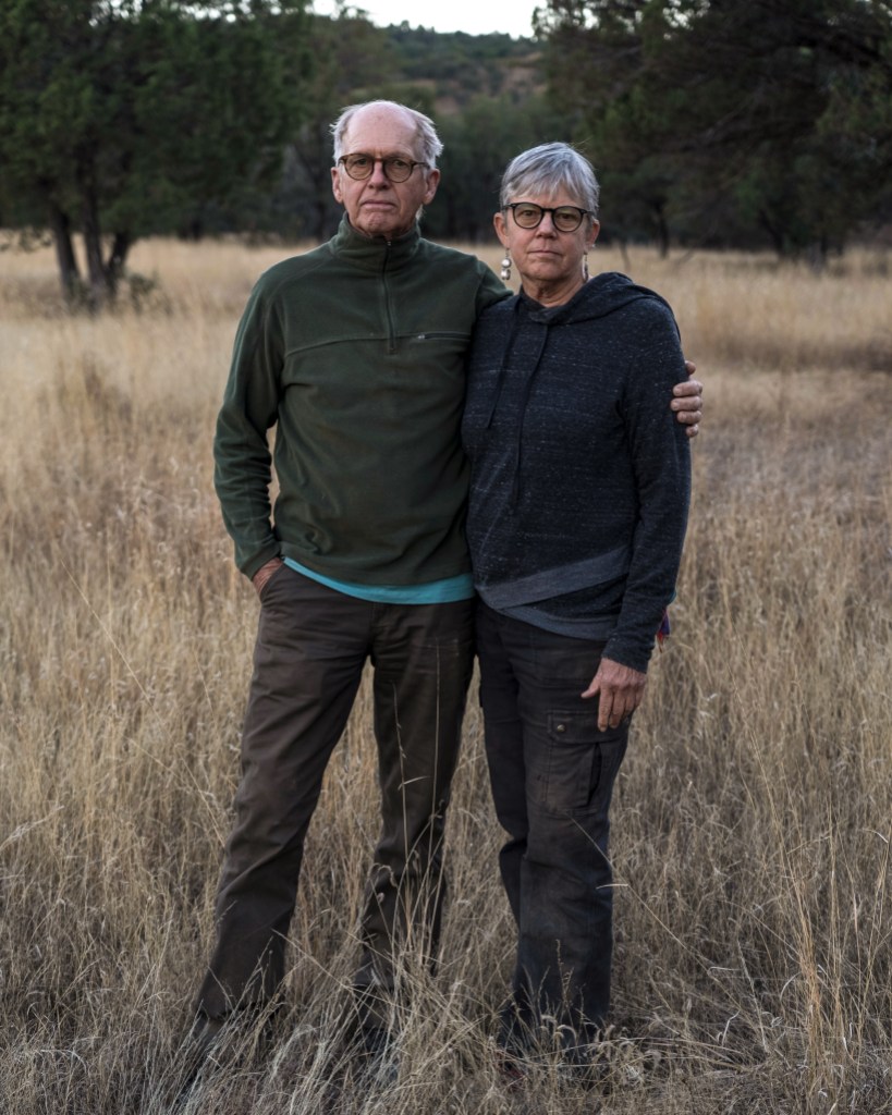 Portrait of Jennifer Wrenn, 68, and Andrew Kayner, 71, outside their home near Elgin, Arizona on November 29th, 2022. (Photo by Kitra Cahana for The Intercept)