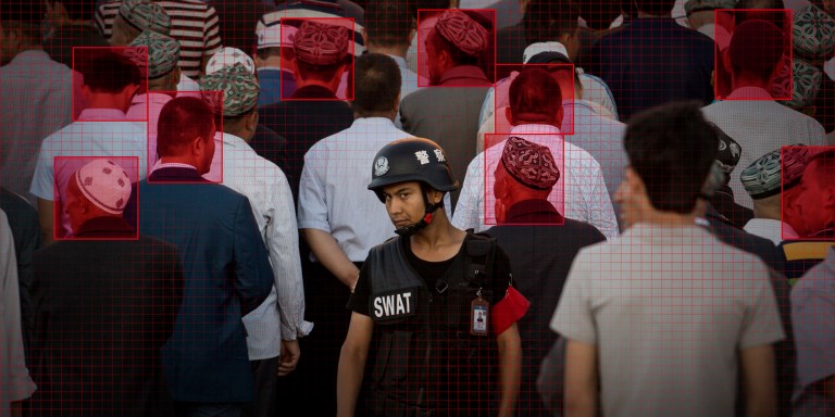 A policeman standing guard as Muslims arrive for the Eid al-Fitr morning prayer at the Id Kah Mosque in Kashgar in China's Xinjiang Uighur Autonomous Region on June 26, 2017.