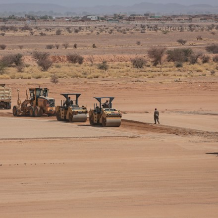 **EMBARGO: No electronic distribution, Web posting or street sales before Sunday 3:00 a.m. ET April 22, 2018. No exceptions for any reasons. EMBARGO set by source.** Air Force engineers and members of 31st Expeditionary RED HORSE squadron work on a landing strip, on the Air Base 201 compound, in Agadez, Niger, April 12, 2018. Hundreds of American troops are working feverishly to convert a barren swath of scrubland here into the Pentagon's newest and potentially deadliest drone base on the African continent, in a sign of the region's widening terrorist threats. (Tara Todras-Whitehill/The New York Times)