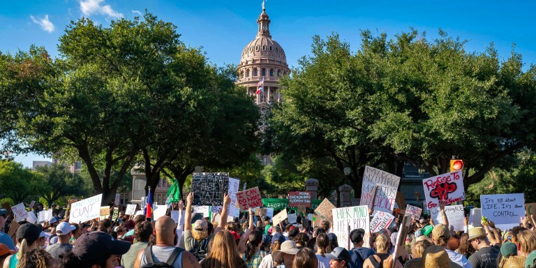 Abortion rights demonstrators gather near the State Capitol in Austin, Texas, June 25, 2022. - Abortion rights defenders fanned out across America on June 25 for a second day of protest against the Supreme Court's thunderbolt ruling, as state after conservative state moved swiftly to ban the procedure. (Photo by SUZANNE CORDEIRO / AFP) (Photo by SUZANNE CORDEIRO/AFP via Getty Images)
