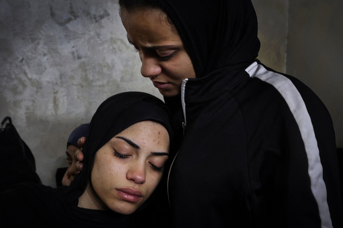 Relatives mourn the death of Palestinian teenager Mahdi Hashash, who died of shrapnel wounds amid an Israeli raid, during his funeral in the refugee camp of Balata near the West Bank city of Nablus on November 9, 2022. (Photo by JAAFAR ASHTIYEH / AFP) (Photo by JAAFAR ASHTIYEH/AFP via Getty Images)