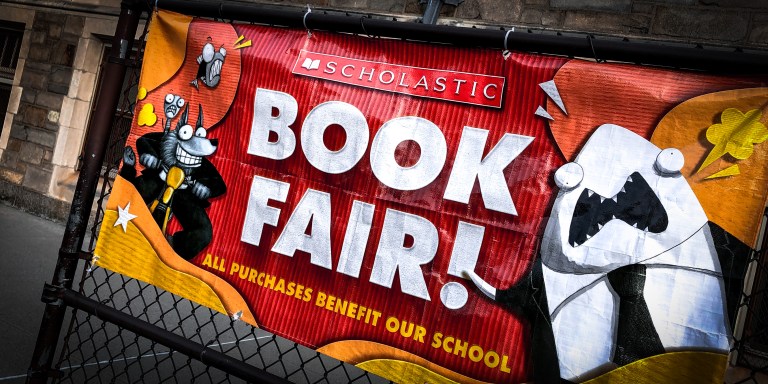 Scholastic Book Fair banner outside Catholic school, Queens, New York. (Photo by: Lindsey Nicholson/UCG/Universal Images Group via Getty Images)