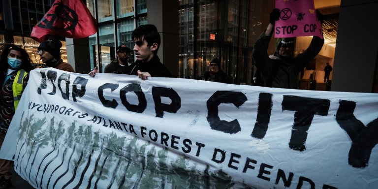 NEW YORK, NEW YORK - MARCH 09: Activists participate in a protest against the proposed Cop City being built in an Atlanta forest on March 09, 2023 in New York City. Cop City, a vast police training facility under construction atop forestland in the Atlanta, Georgia area, has become a focus point of demonstrations opposed to the development in one of the state's most pristine forests. The $90 million training center is designed to train police in militarized urban warfare. (Photo by Spencer Platt/Getty Images)