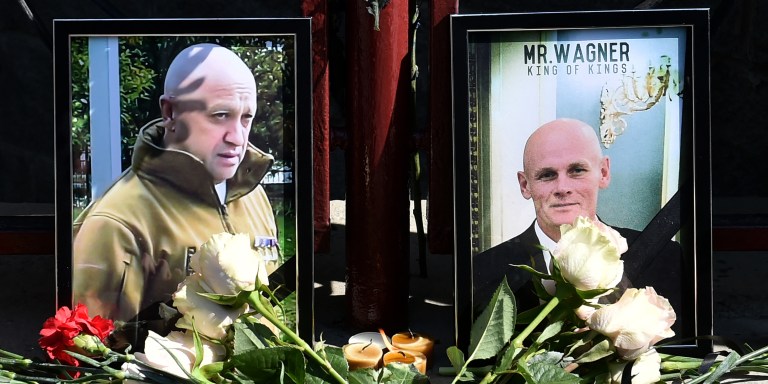 Portraits of Yevgeny Prigozhin (L) and Dmitry Utkin (R), a shadowy figure who managed Wagner's operations and allegedly served in Russian military intelligence, are seen at the makeshift memorial in front of the PMC Wagner office in Novosibirsk, on August 24, 2023. Russian state-run news agencies on August 23, 2023 said that Yevgeny Prigozhin, the head of the Wagner group that led a mutiny against Russia's army in June, was on the list of passengers of a plane that crashed near the village of Kuzhenkino in the Tver region. (Photo by Vladimir NIKOLAYEV / AFP) (Photo by VLADIMIR NIKOLAYEV/AFP via Getty Images)