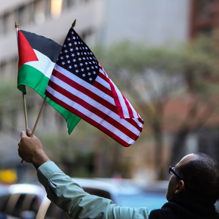 MANHATTAN, NEW YORK CITY, NEW YORK, UNITED STATES - 2015/10/06: US & Palestinian flags held aloft. Al Awda, NYC Students for Justice in Palestine and other activists organizations staged a "Day of Rage" rally in front of the Israeli consulate to protest violence against Palestinians in Israel and the West Bank. (Photo by Andy Katz/Pacific Press/LightRocket via Getty Images)