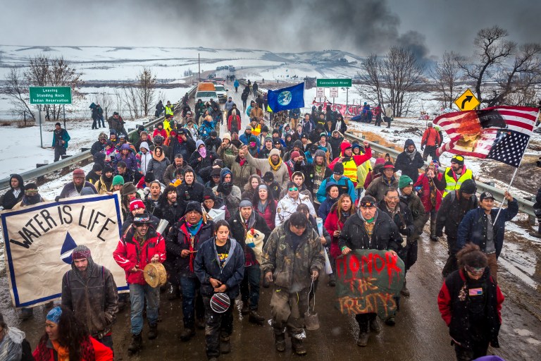 NORTH DAKOTA, UNITED STATES - 2017/02/22: Defiant Dakota Access Pipeline water protectors faced-off with various law enforcement agencies on the day the camp was slated to be raided. Many protesters and independent journalist, who were all threatened with multiple felony charges if they didn't leave were met with militarized police on the road abutting the camp. At least six were arrested, including a journalist who reportedly had sustained a broken hip. (Photo by Michael Nigro/Pacific Press/LightRocket via Getty Images)