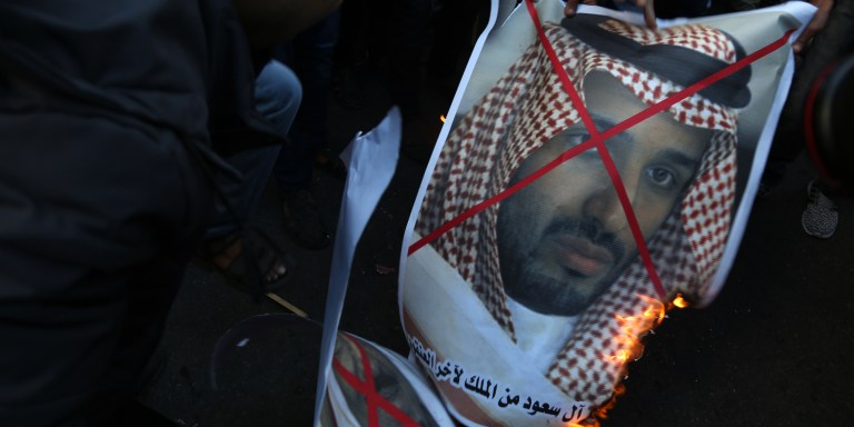 Palestinian Popular Front for the Liberation of Palestine supporters burn photos of Saudi King Salman bin Abdulaziz Al Saud, and Saudi Deputy Crown Prince Mohammed bin Salman, during a demonstration to protest against US President Donald Trump's decision to recognize Jerusalem as Israel's capital, in Gaza City, Saturday, Dec. 9, 2017. (Photo by Majdi Fathi/NurPhoto via Getty Images)
