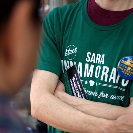 A campaign worker wears a shirt in support of Sara Innamorato, Democratic U.S. Senate candidate from Pennsylvania, while speaking with voters outside a polling location at the Oakmont United Methodist Church in Pittsburgh, Pennsylvania, U.S., on Tuesday, May 15, 2018. Results from Tuesday's primary in the battleground state of Pennsylvania will offer fresh insight into whether Democrats can seize an opportunity -- or miss a chance -- to end one-party control of Washington under President Donald Trump. Photographer: Justin Merriman/Bloomberg via Getty Images