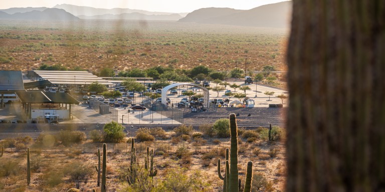 Why, Ariz. 7/20/23: roughly 50 migrants held outside at the Ajo Border Patrol Station during record breaking heatwave in Why, Ariz. on Thursday, July 20, 2023. (Ash Ponders for The The Intercept)